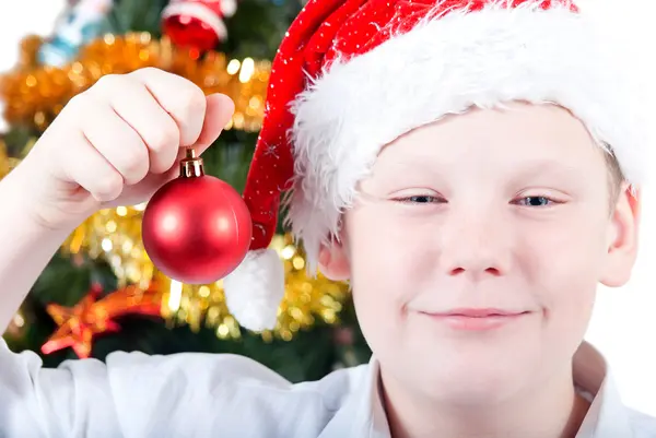 Portrait of a boy on the background of the Christmas tree — Stock Photo, Image