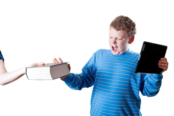 Мальчик с планшетом толкает книгу — стоковое фото