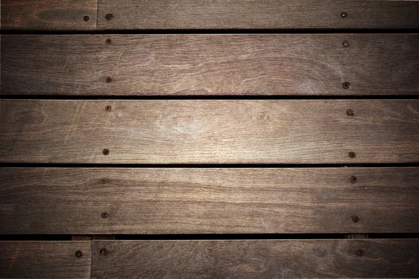Fragment van de oude houten planken met spijkers — Stockfoto
