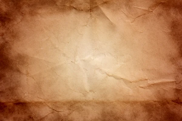 Old crumpled paper with burning edges — Stock Photo, Image