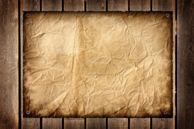 old scorched paper on the wooden texture clipart