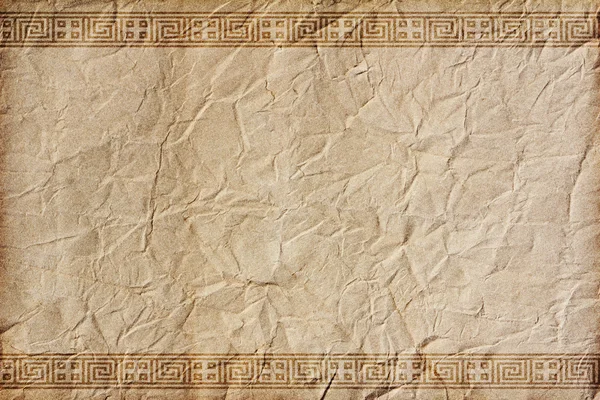 Gamla skrynkligt papper med ornament i grekisk stil Royaltyfria Stockfoton