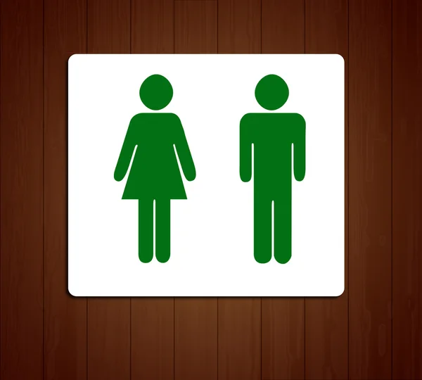 Gröna toaletter wc skylt för män och kvinnor (trä bakgrund) Stockbild