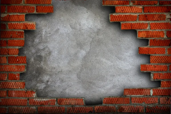 Τραχυμένη τοίχο που περιβάλλεται με τούβλα Φωτογραφία Αρχείου