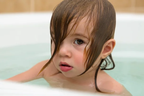 Toddler Girl giving Thoughtful Expression Stock Photo