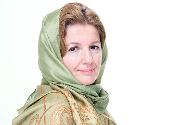 Beautiful mature woman in a headscarf — Stock Photo, Image