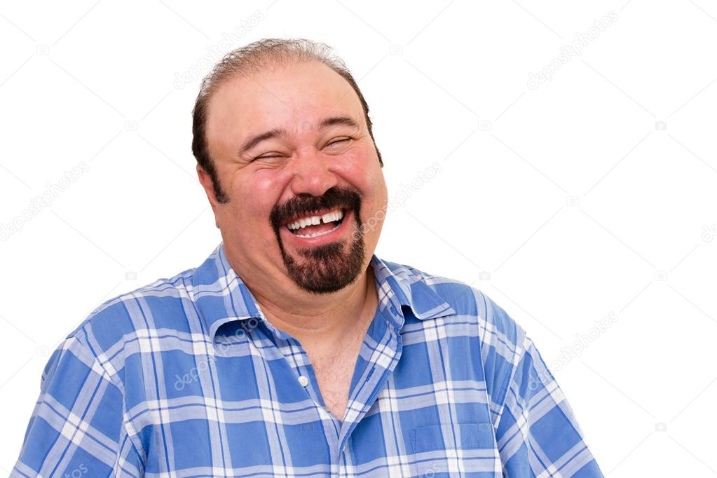 Joyful bearded Caucasian man laughing loud