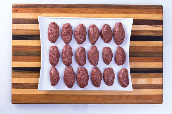 Prepped Ready to Cook Turkish Meat Balls on a wooden Board — Stock Photo, Image