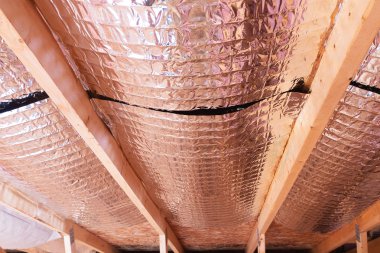 Reflective Radiant Heat Barriers Between Attic Joists Used as Ba