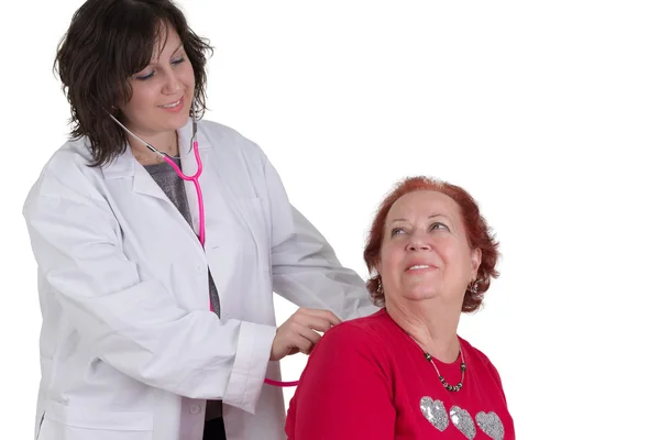 Female doctor examining a patient — Stock Photo, Image