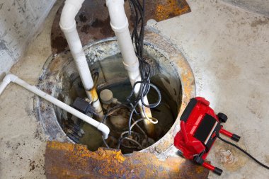 Repairing a sump pump in a basement clipart