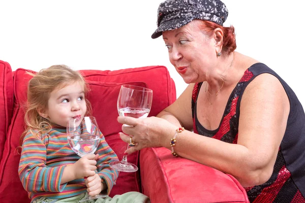 Mischievous grandmother and granddaughter — Stock Photo, Image