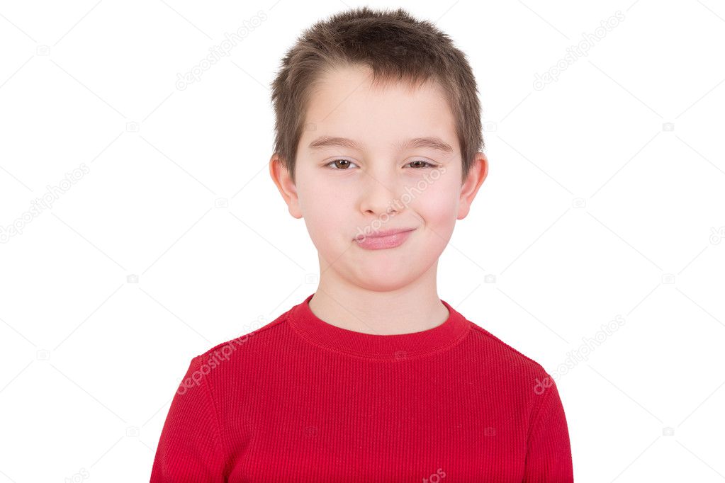 Skeptical young boy with a disbelieving expression