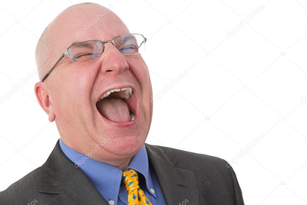 Middle-aged bald businessman laughing out loud