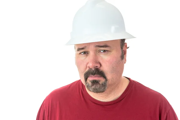 Thoughtful man wearing a hardhat — Stock Photo, Image