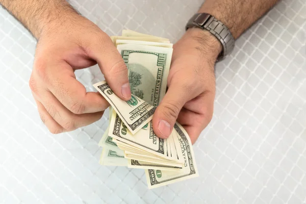 Man counting dollar notes — Stock Photo, Image