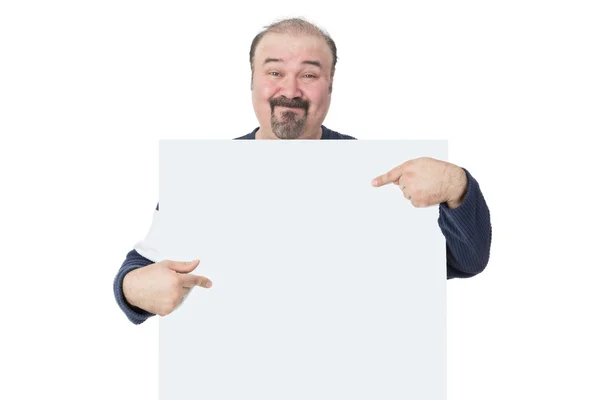 Smiling man holding and pointing to a billboard — Stock Photo, Image