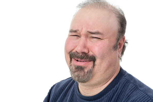 Close-up portrait of a man laughing in disbelief