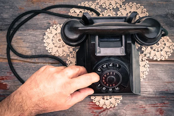 Man making a call on a rotary telephone — Stock Photo, Image