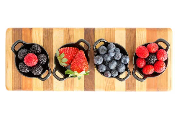 Ripe fresh autumn berries in separate dishes — Stock Photo, Image