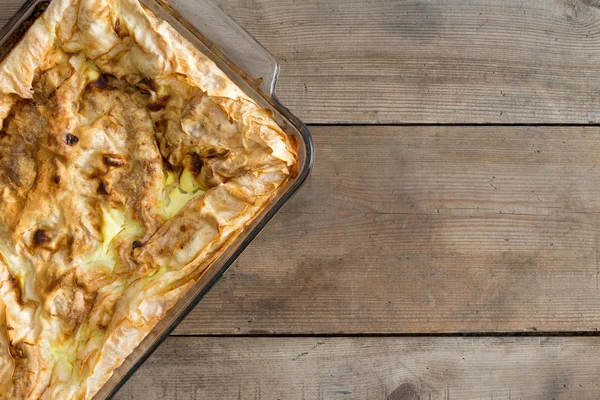 Fresh homemade Turkish borek in an oven dish — Stock Photo, Image