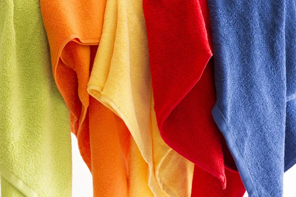 Colorful towels hanging in a row — Stock Photo, Image