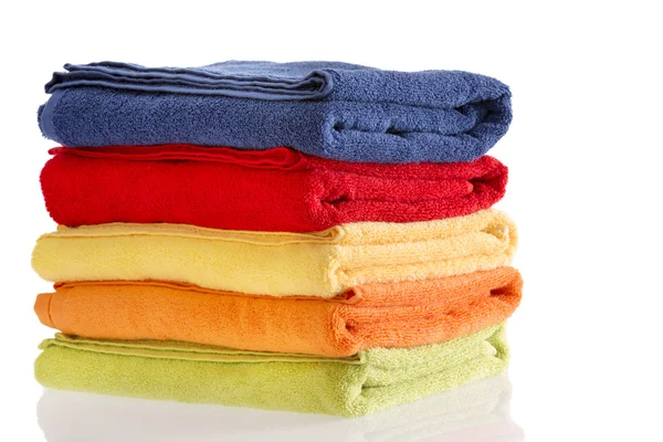 Pile of neatly folded colorful cotton towels — Stock Photo, Image