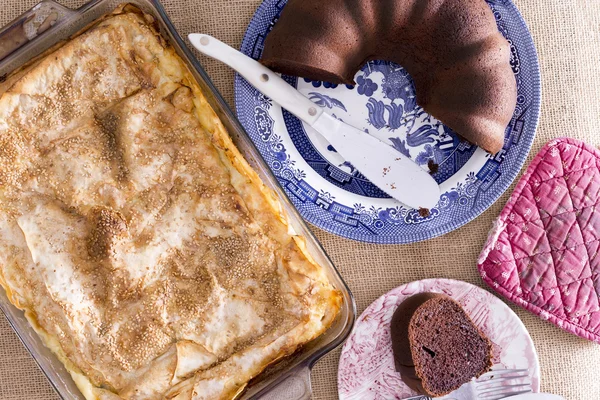 Fresh crispy borek pastry and chocolate cake — Stock Photo, Image