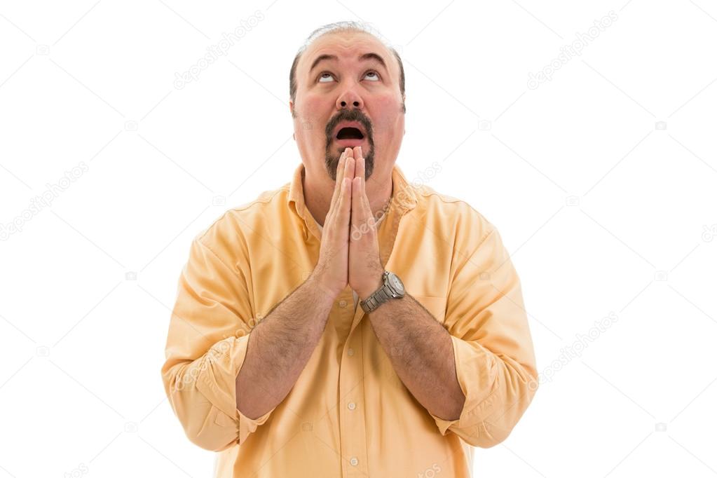 Middle-aged man praying to heaven for help