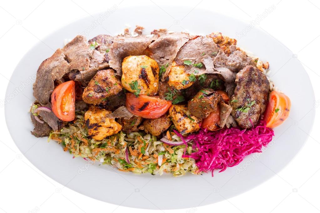 Mixed shish kebabs served with vegetables