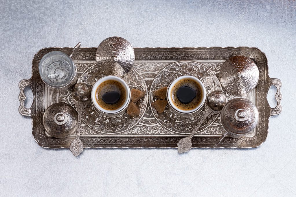 Turkish coffee for two served on a metal tray