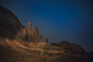 Courthouse Towers Desert Landscape at night clipart