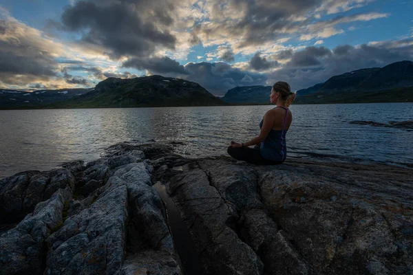 Woman Practices Yoga Rocky Shore Stavatn Lake Royalty Free Stock Images