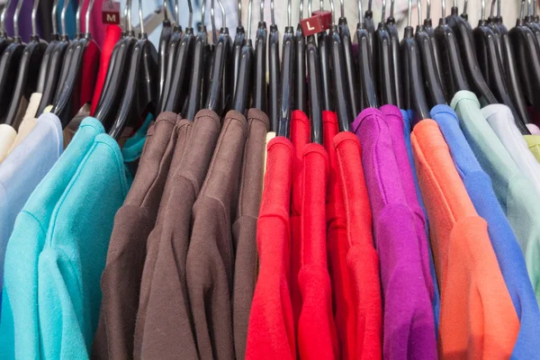 Rail of knitted jumpers in various colors — Stock Photo, Image