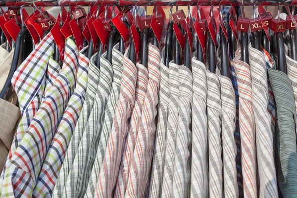 Rail of patterned men's shirts — Stock Photo, Image