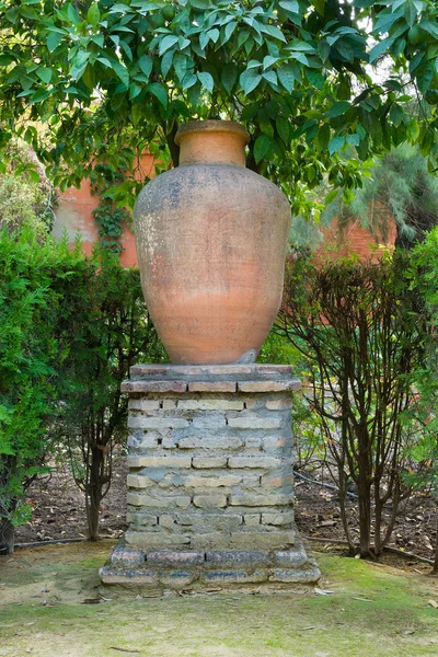Garden urn on a large brick stand as a decorative feature Stock Image