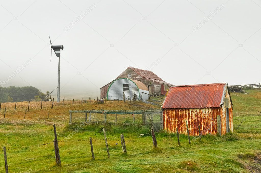 Corrugated iron farm outbuildings and wind turbine