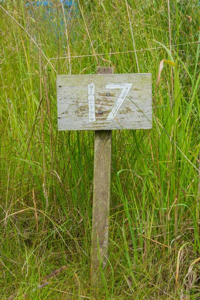 Wooden sign giving garden plot number — Stock Photo, Image