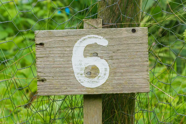 Wooden sign giving garden plot number — Stock Photo, Image