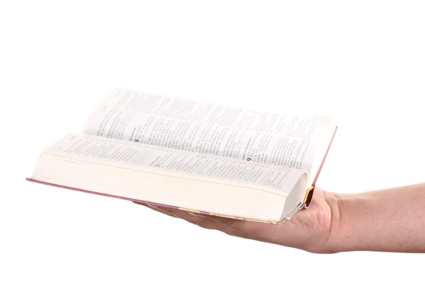 Молитовна рука тримає відкриту Біблію — стокове фото