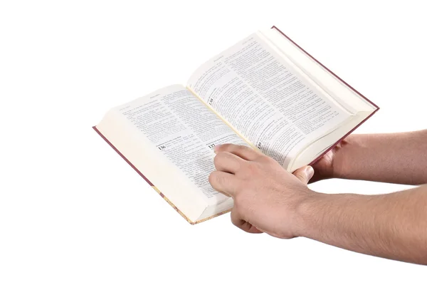 La main priante tient une bible ouverte — Photo