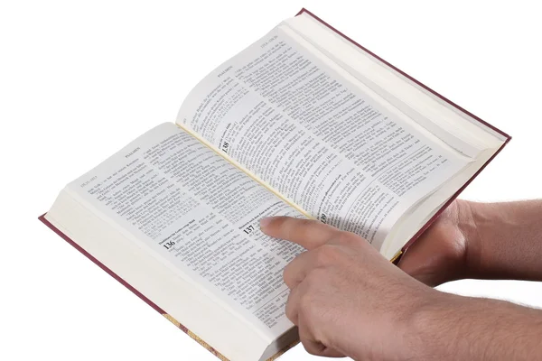 Imádkozó kéz tart amely nyitott Bibliát — Stock Fotó
