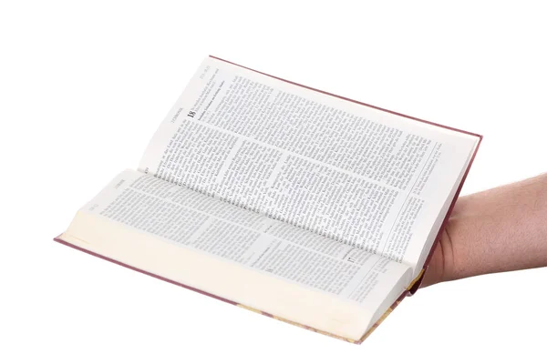 La main priante tient une bible ouverte — Photo