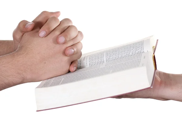 Betende Hand hält eine offene Bibel — Stockfoto