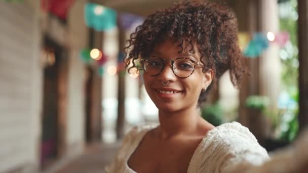 Closeup Portrait Young Woman Glasses Smiling Poses Sends Air Kiss — Stock Video