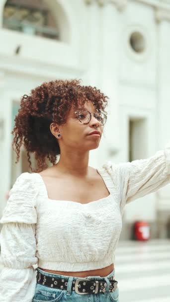 Vertical Video Young Woman Glasses Carefully Studying Information Stand Closeup — Stock Video