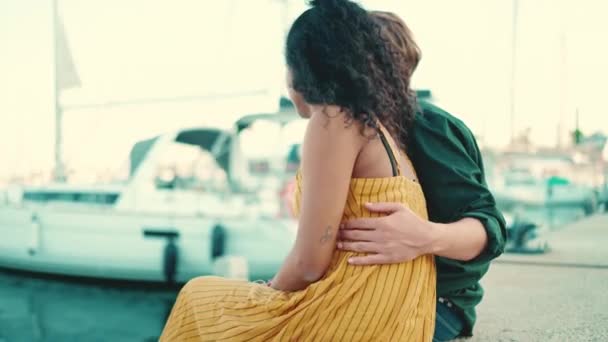 Close Man Hugs Woman Closeup Happy Interracial Couple Sitting Embankment — Stock Video