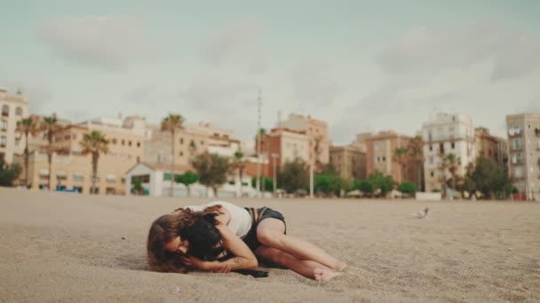 Smiling Girl Long Wavy Hair White Top Plays Beach Black — Stock Video