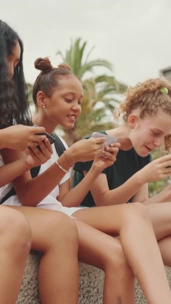 Vertical Video Three Girls Friends Pre Teenage Sitting Waterfront Using — Stockvideo