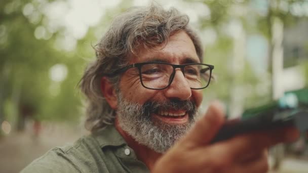 Clouse Smiling Middle Aged Man Gray Hair Beard Sits Bench — Stockvideo